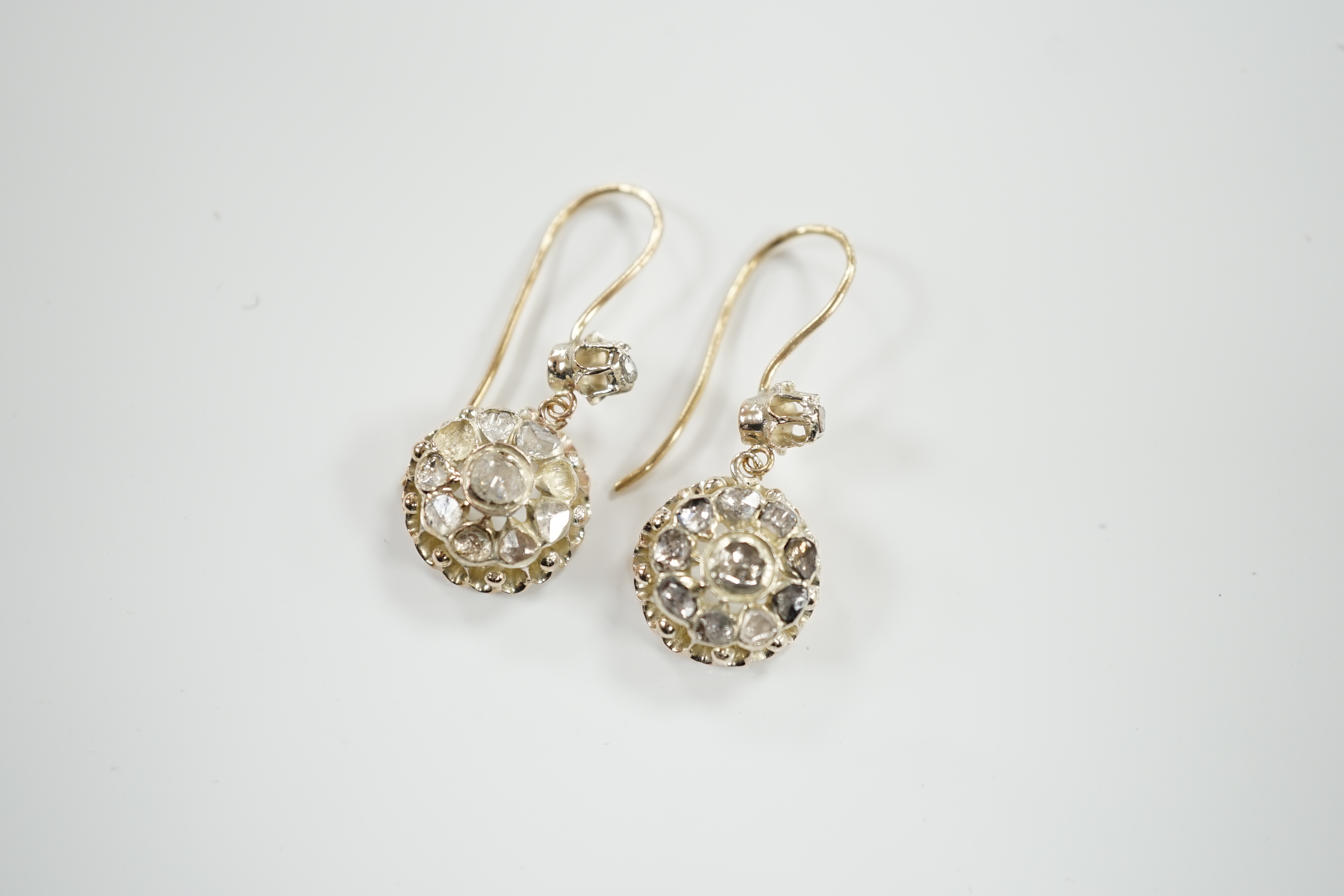 A pair of antique style yellow metal and rose cut diamond cluster set drop earrings, 24mm, gross weight 6.6 grams (stones missing).